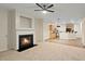 Open-concept living room with a fireplace and seamless flow into the kitchen at 3300 Suttles Sw Dr, Atlanta, GA 30331
