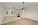 Cozy living room with a fireplace, a ceiling fan, and a door leading to the backyard at 3300 Suttles Sw Dr, Atlanta, GA 30331