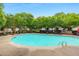Community pool with lounge chairs and lush trees providing a relaxing atmosphere at 3300 Suttles Sw Dr, Atlanta, GA 30331