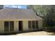 Backyard view featuring sliding doors to the interior and mature trees at 3510 Hog Mountain Rd, Dacula, GA 30019