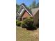 Home featuring brick, siding, landscaping, and a well maintained roof and windows at 3510 Hog Mountain Rd, Dacula, GA 30019
