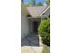 Elegant front door with side windows, and a large bush providing curb appeal at 3510 Hog Mountain Rd, Dacula, GA 30019