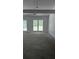 Spacious living room with vaulted ceilings and a neutral color palette and large windows at 3510 Hog Mountain Rd, Dacula, GA 30019