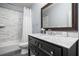 Clean bathroom with marble-look tile shower, and a dark wood vanity with a marble countertop at 406 Mareeba Park # 61, Canton, GA 30114