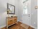 Foyer featuring a decorative table, mirror, and stylish front door, creating a welcoming entrance at 406 Mareeba Park # 61, Canton, GA 30114