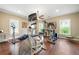 Exercise room with hard wood floors, multiple machines and natural light at 406 Mareeba Park # 61, Canton, GA 30114