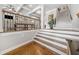 Foyer with wood floors, elegant staircase, and open view to the living room, showcasing a welcoming entrance at 406 Mareeba Park # 61, Canton, GA 30114