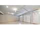 Spacious two car garage with epoxy flooring, white doors and mini split system at 406 Mareeba Park # 61, Canton, GA 30114