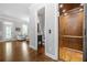 Hallway featuring an elevator, bathroom, and hardwood floors, providing easy access to different areas of the home at 406 Mareeba Park # 61, Canton, GA 30114