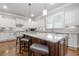 Spacious kitchen with a large marble island, white cabinetry, and modern appliances, perfect for culinary enthusiasts at 406 Mareeba Park # 61, Canton, GA 30114