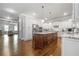 Open kitchen with a central island, ample storage, and stainless steel appliances, flowing into the living area at 406 Mareeba Park # 61, Canton, GA 30114