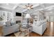 Spacious living room featuring a stone fireplace, built-in shelving, and elegant furnishings, creating a cozy atmosphere at 406 Mareeba Park # 61, Canton, GA 30114