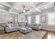 Cozy living room featuring coffered ceilings, a ceiling fan, and comfortable seating arrangements, perfect for relaxation at 406 Mareeba Park # 61, Canton, GA 30114