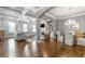 Open-concept living space with a combined living and dining area, showcasing hardwood floors and natural light at 406 Mareeba Park # 61, Canton, GA 30114