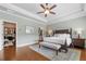 Spacious main bedroom with an ensuite bathroom and walk-in closet, features hardwood floors and neutral paint at 406 Mareeba Park # 61, Canton, GA 30114