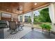 Covered patio with outdoor dining set, ceiling fan and curtains for shade and privacy at 406 Mareeba Park # 61, Canton, GA 30114