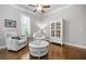 Bright sitting room featuring hardwood floors, a ceiling fan, and comfortable seating with white accents at 406 Mareeba Park # 61, Canton, GA 30114