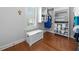 Organized walk-in closet with custom shelving, drawers, and ample storage space; features hardwood floors at 406 Mareeba Park # 61, Canton, GA 30114