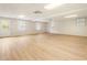 Spacious basement featuring wood-look flooring, windows, and a door to the outside at 251 Waller Nw Cir, Marietta, GA 30064