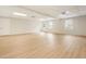 Finished basement with wood flooring, recessed lighting, and windows providing natural light at 251 Waller Nw Cir, Marietta, GA 30064