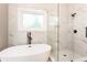 Contemporary bathroom features glass enclosed shower, soaking tub, and serene design at 251 Waller Nw Cir, Marietta, GA 30064