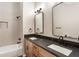 Stylish bathroom with dual sinks, granite countertop, and modern fixtures at 251 Waller Nw Cir, Marietta, GA 30064