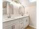 Bright bathroom featuring a double vanity with modern fixtures and framed mirrors at 251 Waller Nw Cir, Marietta, GA 30064
