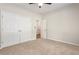 Bedroom features a ceiling fan and ample closet space at 251 Waller Nw Cir, Marietta, GA 30064