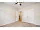 Bedroom features closet, ceiling fan, neutral carpet, and access to the bathroom at 251 Waller Nw Cir, Marietta, GA 30064