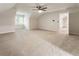 Bonus room features neutral carpet, ceiling fan, fresh paint, and lots of natural light at 251 Waller Nw Cir, Marietta, GA 30064