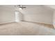 Spacious bonus room boasts neutral carpet, fresh paint, and modern ceiling fan at 251 Waller Nw Cir, Marietta, GA 30064