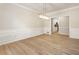 A spacious dining room with modern light fixture and wood floor at 251 Waller Nw Cir, Marietta, GA 30064