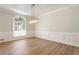 A spacious dining room with modern light fixture and wood floor at 251 Waller Nw Cir, Marietta, GA 30064