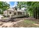 Exterior view of home featuring large deck, screened porch, and lush backyard at 251 Waller Nw Cir, Marietta, GA 30064