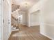 Inviting foyer with wood floors, staircase, and elegant lighting at 251 Waller Nw Cir, Marietta, GA 30064