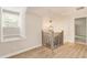 Upstairs hallway with wood flooring, a window seat, and a modern railing at 251 Waller Nw Cir, Marietta, GA 30064