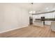 Bright, open kitchen featuring white cabinets, stainless steel appliances and island with pendant lighting at 251 Waller Nw Cir, Marietta, GA 30064
