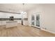 Modern kitchen with white cabinets, stainless appliances, island and access to outdoor area through glass doors at 251 Waller Nw Cir, Marietta, GA 30064