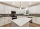 Kitchen featuring white cabinets, stainless steel appliances, and center island at 251 Waller Nw Cir, Marietta, GA 30064