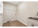 Functional laundry room with modern sink, cabinet and laminate floors for ease of use at 251 Waller Nw Cir, Marietta, GA 30064