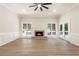 Bright living room with fireplace, large windows, and hardwood floors at 251 Waller Nw Cir, Marietta, GA 30064