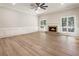 Spacious living room with a fireplace, hardwood floors and large windows at 251 Waller Nw Cir, Marietta, GA 30064