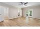 Spacious main bedroom boasts modern ceiling fan and French doors to private deck at 251 Waller Nw Cir, Marietta, GA 30064