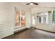 Wooden deck with ceiling fan, and glass door leading into the bright kitchen at 251 Waller Nw Cir, Marietta, GA 30064