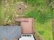 Aerial view of backyard showing a wooden deck, patio with fire pit, and partially wooded lot at 2638 Clairmont Rd, Atlanta, GA 30329