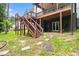 Backyard view of house with a two-story deck and access to a well maintained lawn at 2638 Clairmont Rd, Atlanta, GA 30329