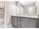 Bathroom featuring double vanity, stone countertop, and modern fixtures at 2638 Clairmont Rd, Atlanta, GA 30329