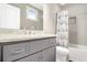 Cozy bathroom featuring a modern vanity with granite countertop and a shower-tub combo at 2638 Clairmont Rd, Atlanta, GA 30329