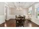 Elegant dining room with decorative ceilings, hardwood floors, and traditional wainscoting at 2638 Clairmont Rd, Atlanta, GA 30329