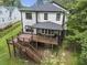 Back exterior of home with a deck and staircase, offering scenic views of the backyard at 2638 Clairmont Rd, Atlanta, GA 30329